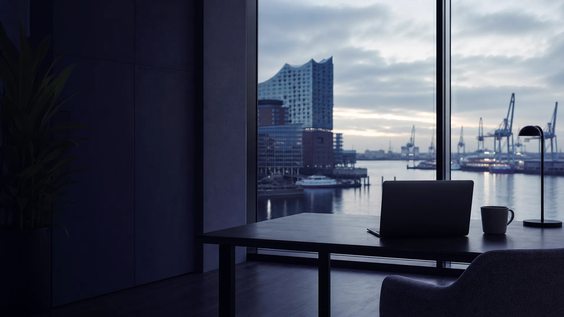 Blick auf die Hamburger Hafencity mit modernem Bürogebäude und Laptop-Silhouette im Vordergrund